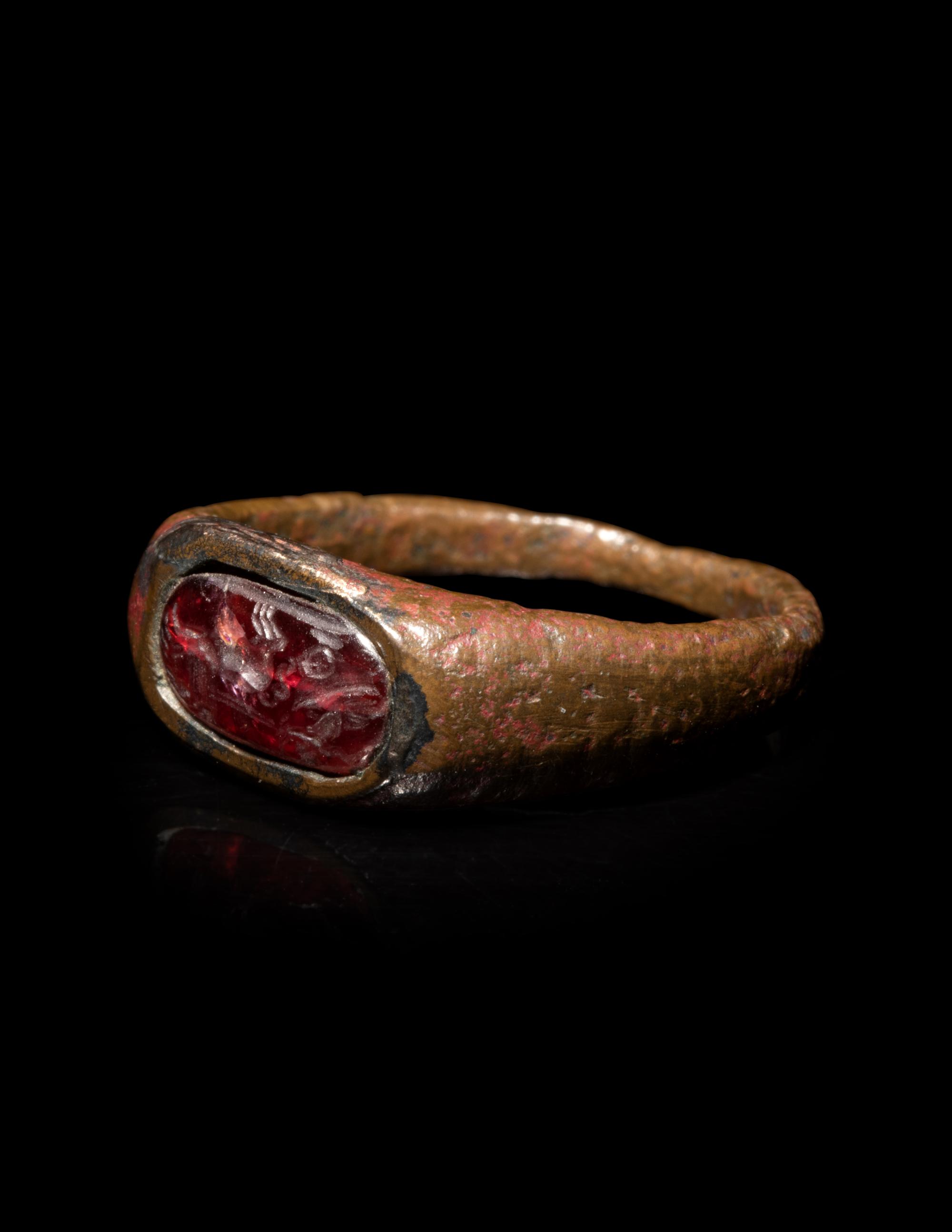 A Roman Bronze and Carnelian Finger Ring