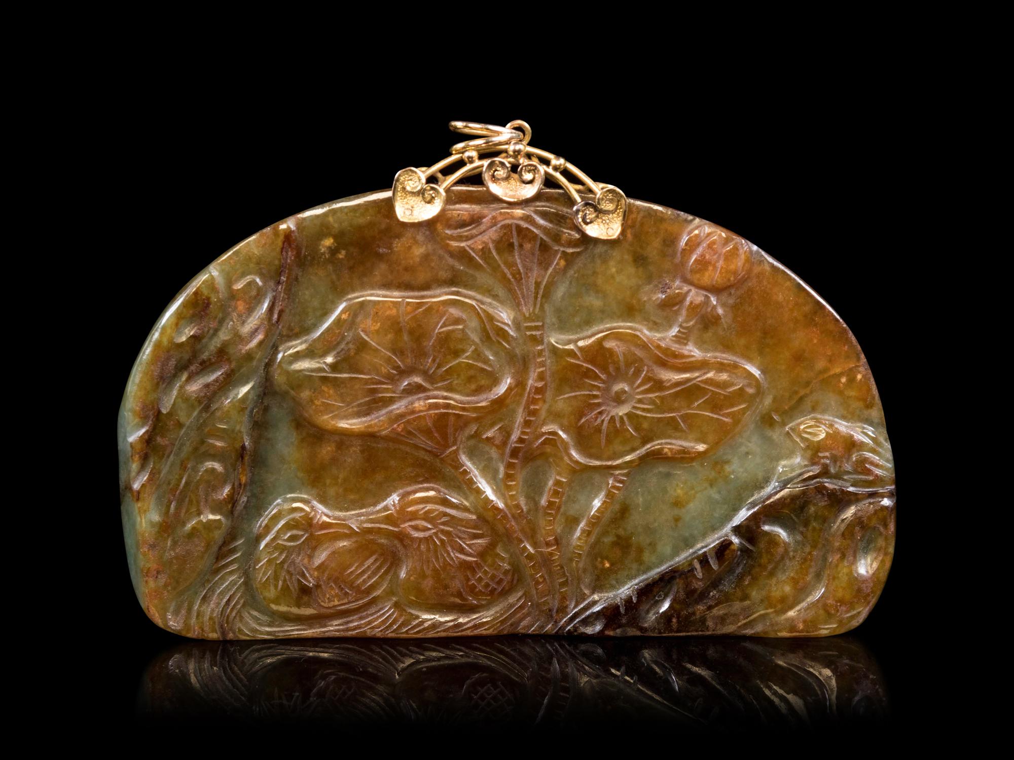 A Celadon and Russet Jade Pendant