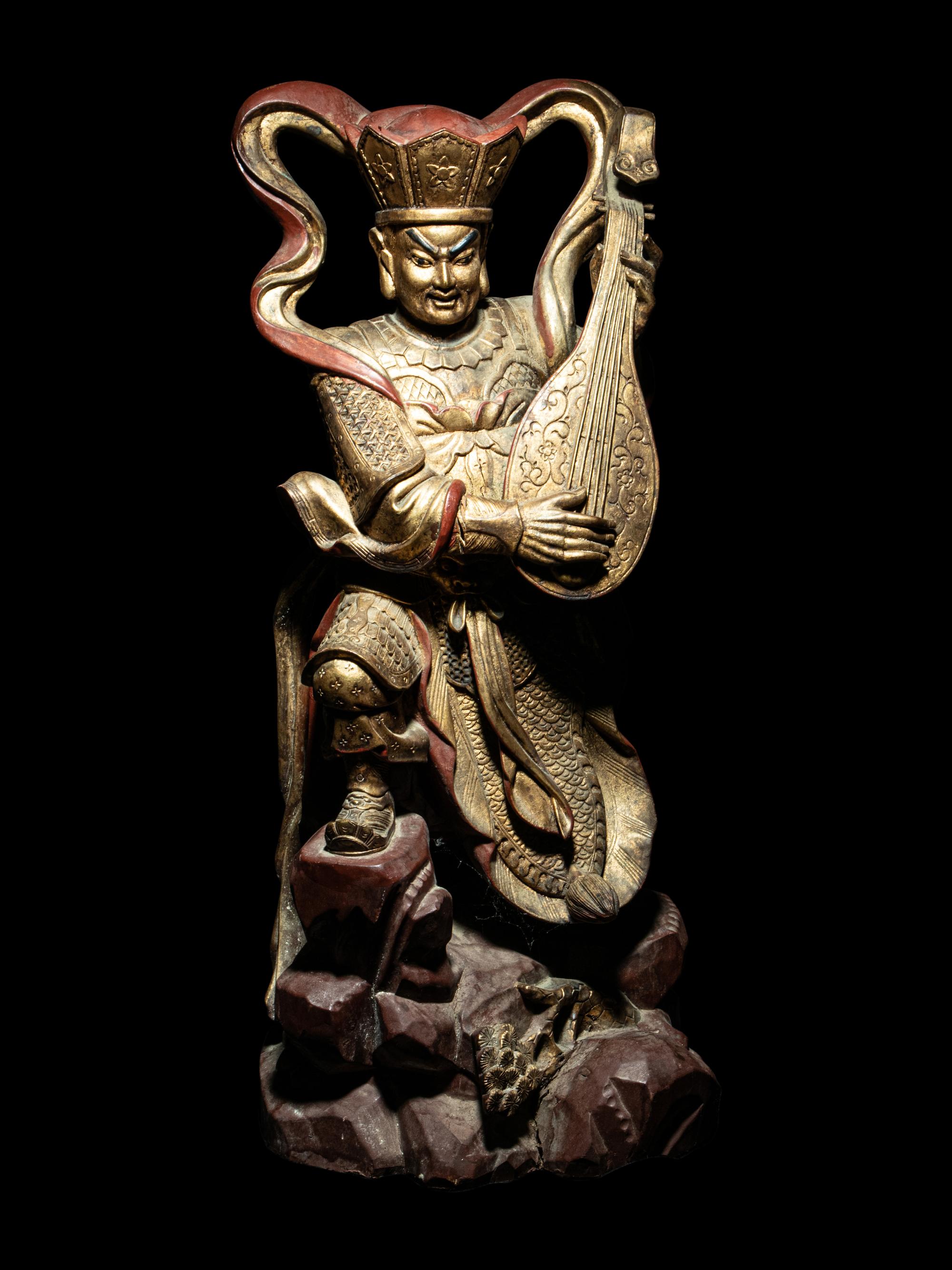 A Set of Four Gilt and Red Lacquered Wood Figures of Guardians