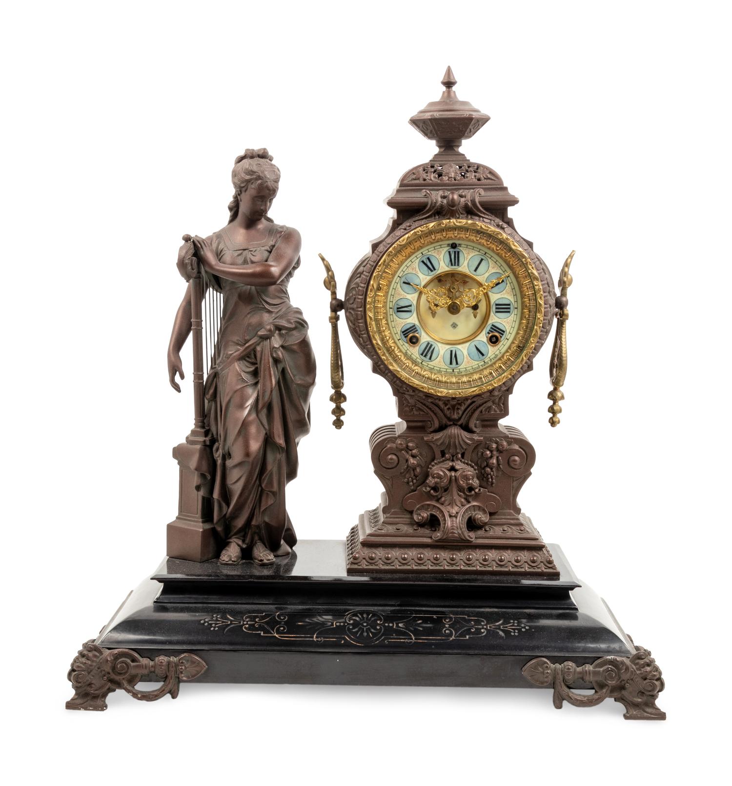 An Ansonia Music Patinated Metal Mantel Clock