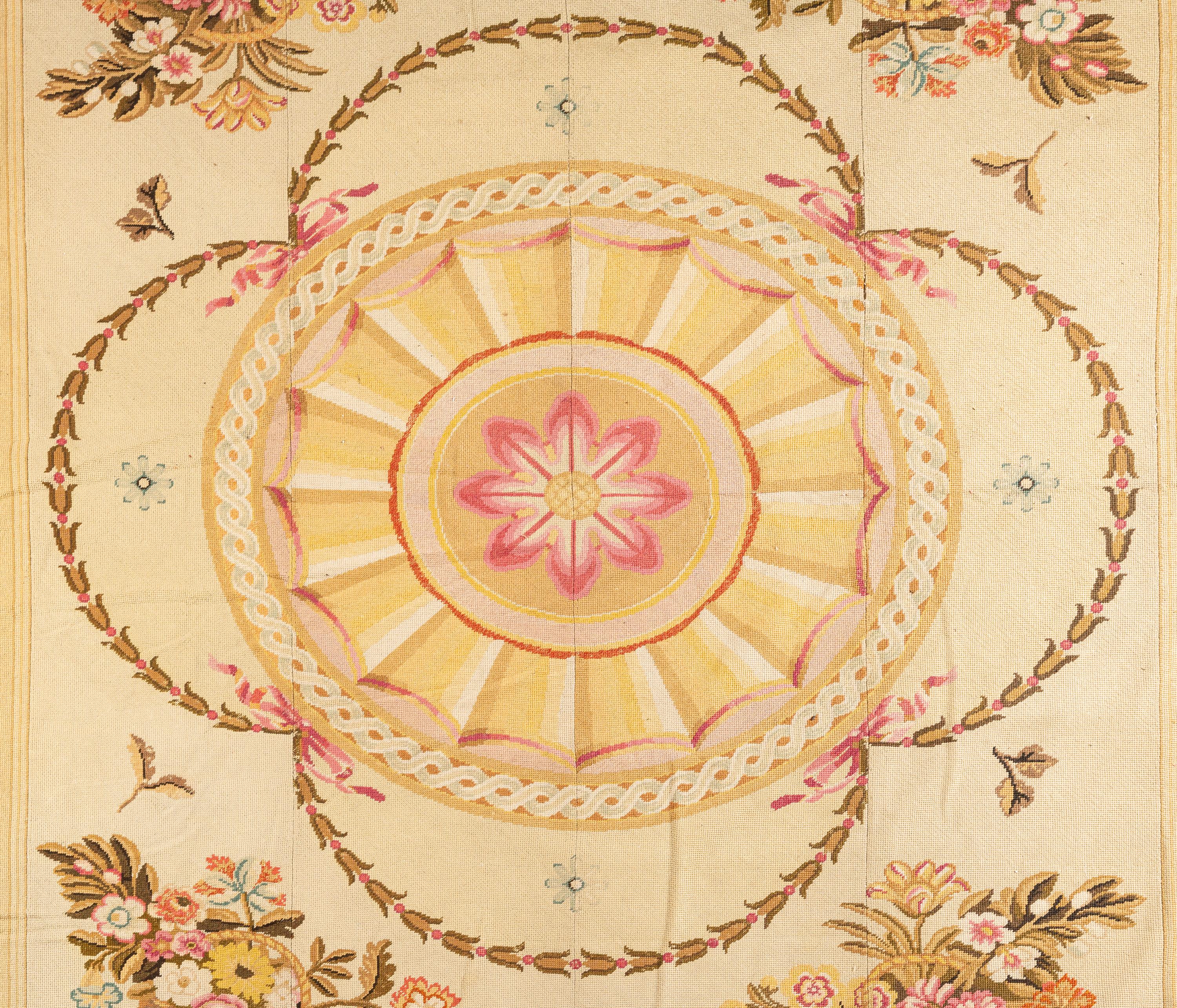 A Large Needlepoint Wool Rug