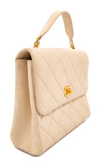 A Chanel Cream Lambskin Quilted Square Flap Bag, 8" H x 9.5" W x 3" D; Handle drop: 3".