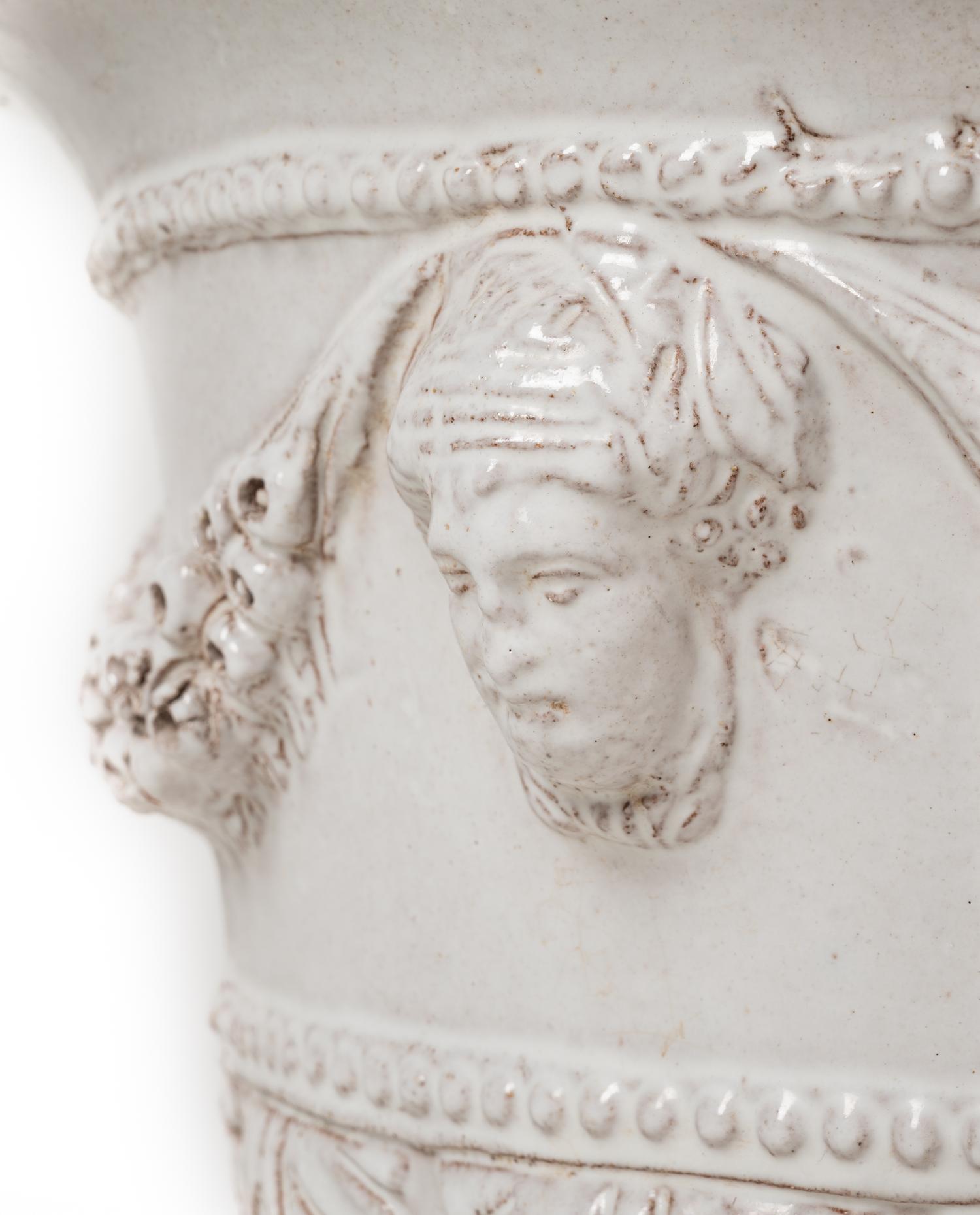 A White Glazed Pottery Jardinière and a Brass Jardinière
