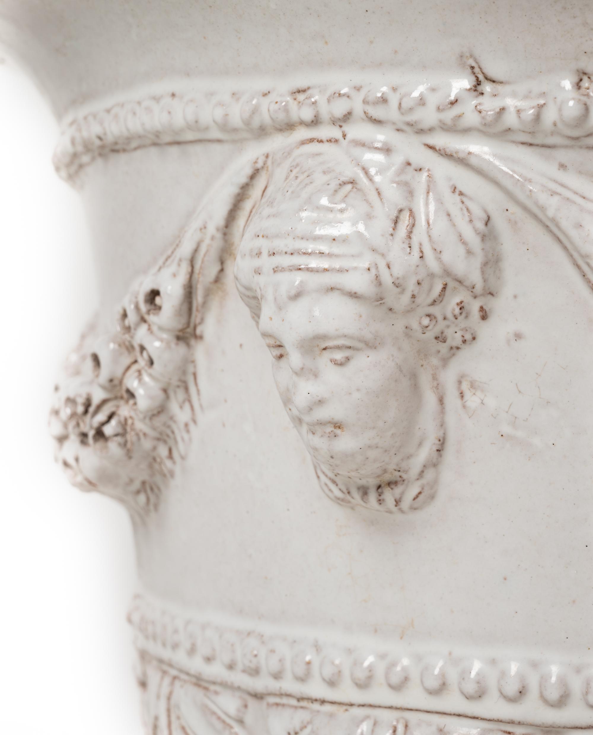 A White Glazed Pottery Jardinière and a Brass Jardinière
