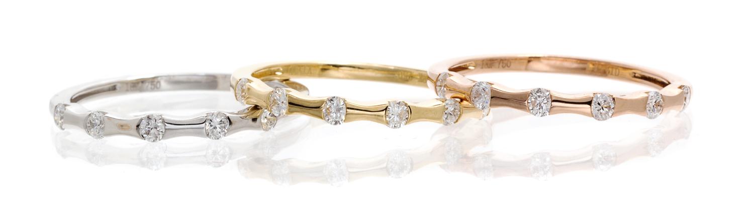 A Collection of 18 Karat Tricolor Gold and Diamond Stacking Rings, 3.20 dwts.