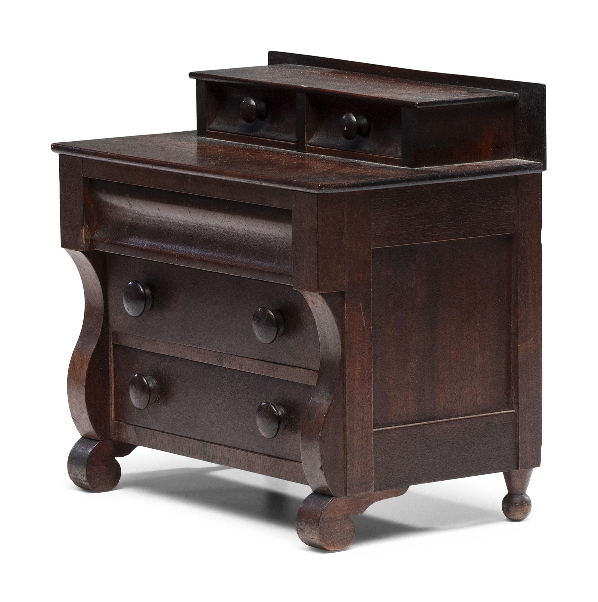 A Diminutive American Empire Mahogany Chest of Drawers
