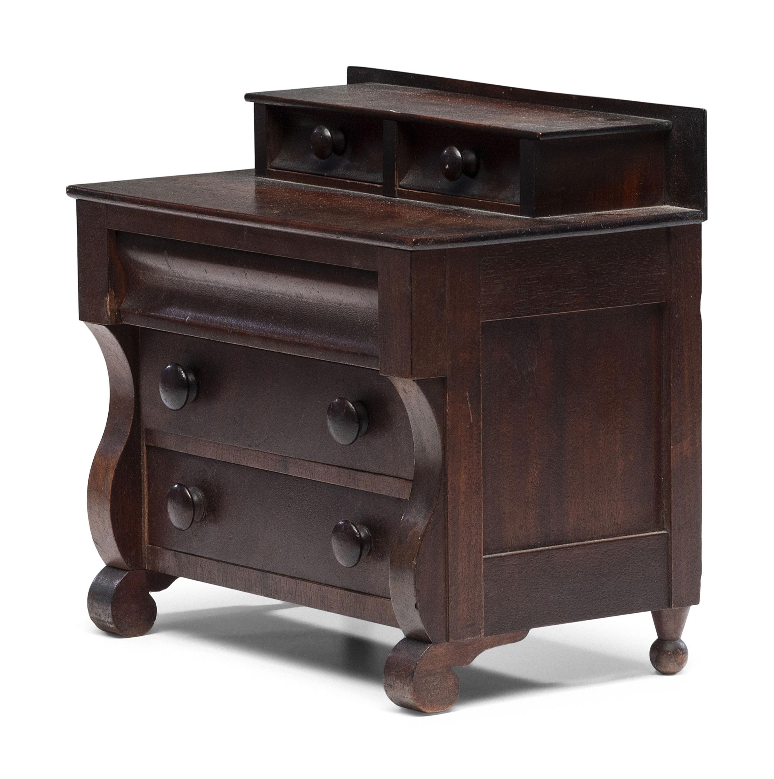 A Diminutive American Empire Mahogany Chest of Drawers