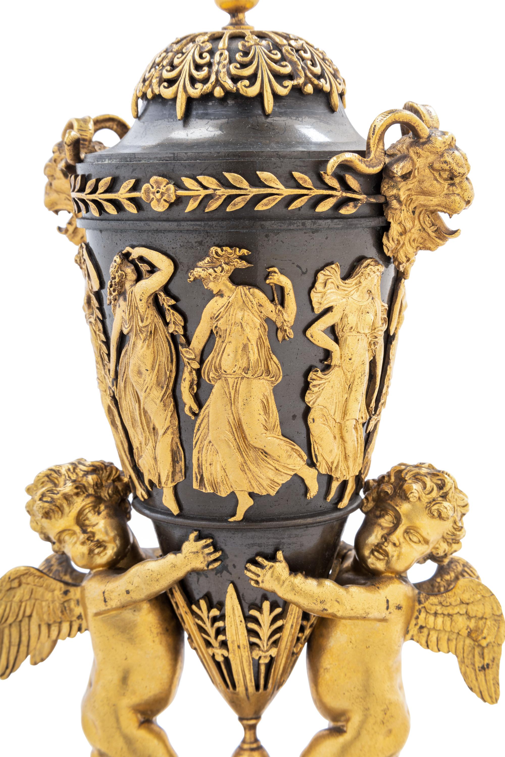 A Pair of Directoire Revival Gilt and Patinated Bronze Urn Ornaments