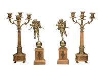 A Pair of Brass and Marble Cherub Bookends and Four-Light Candelabra