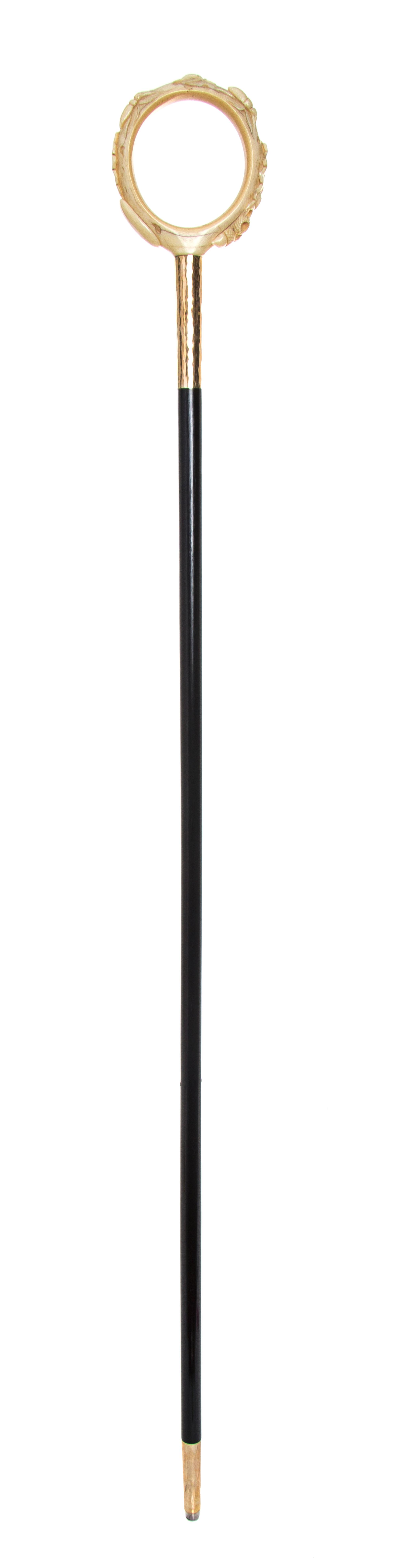 A Japanese Ivory Handled Cane, Diameter of handle 4 x length overall 36 inches.