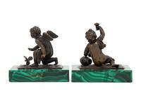 A Pair of Bronze Figures of Kneeling Putti