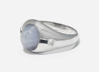 A 20K White Gold, Star Sapphire, and Diamond Ring