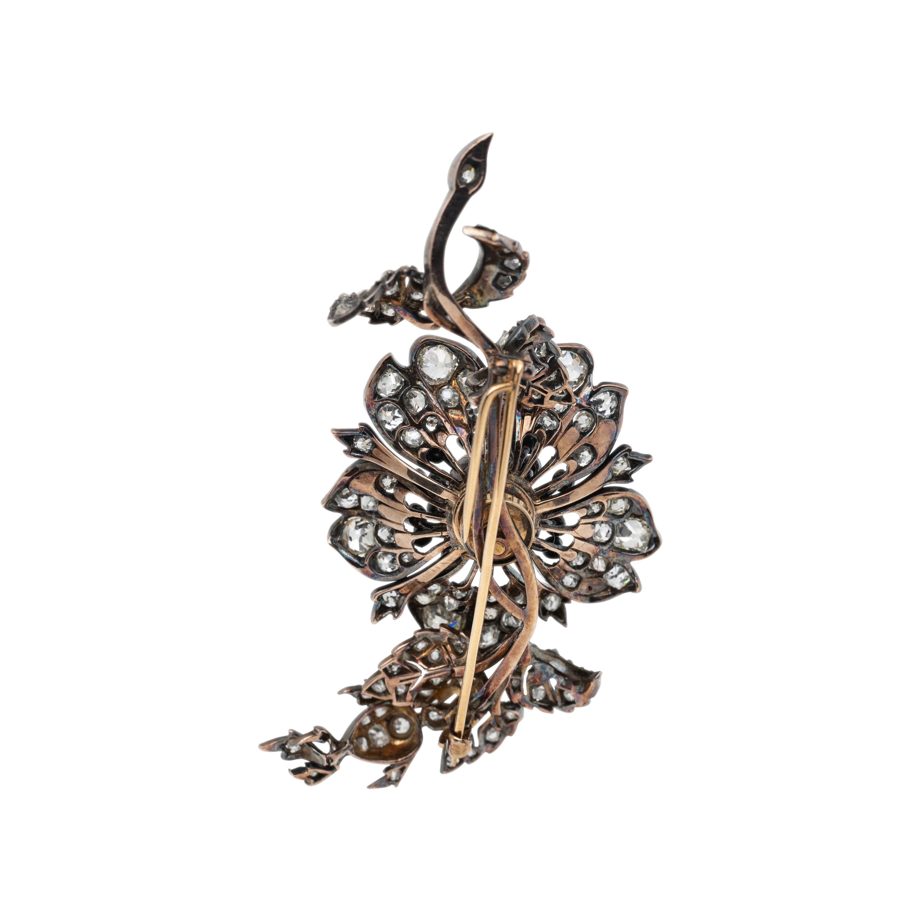 SILVER-TOPPED GOLD AND DIAMOND 'EN TREMBLANT' BROOCH
