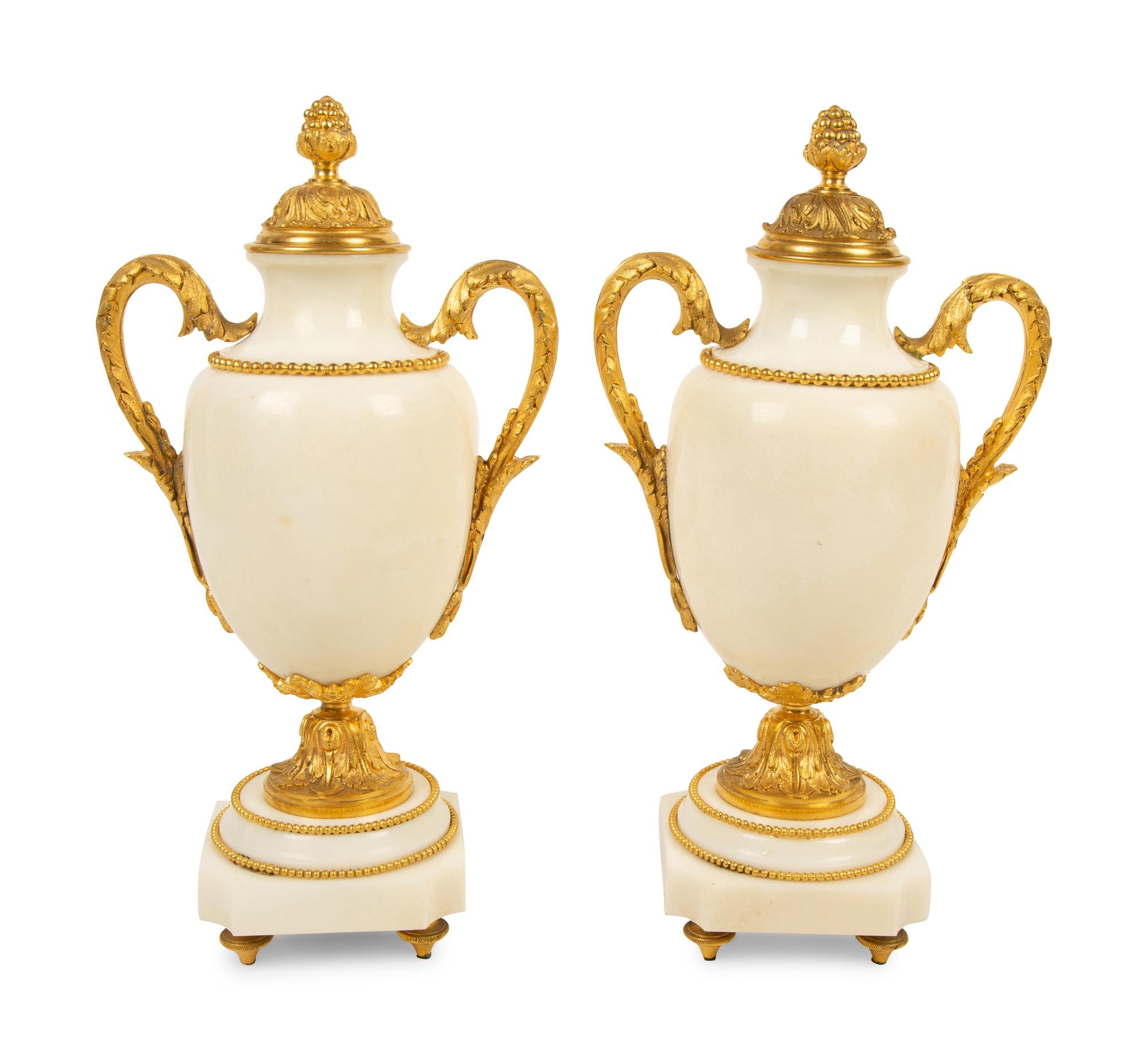 A Pair of Empire Style Gilt Bronze Mounted White Marble Urns — 19TH/20TH CENTURY
