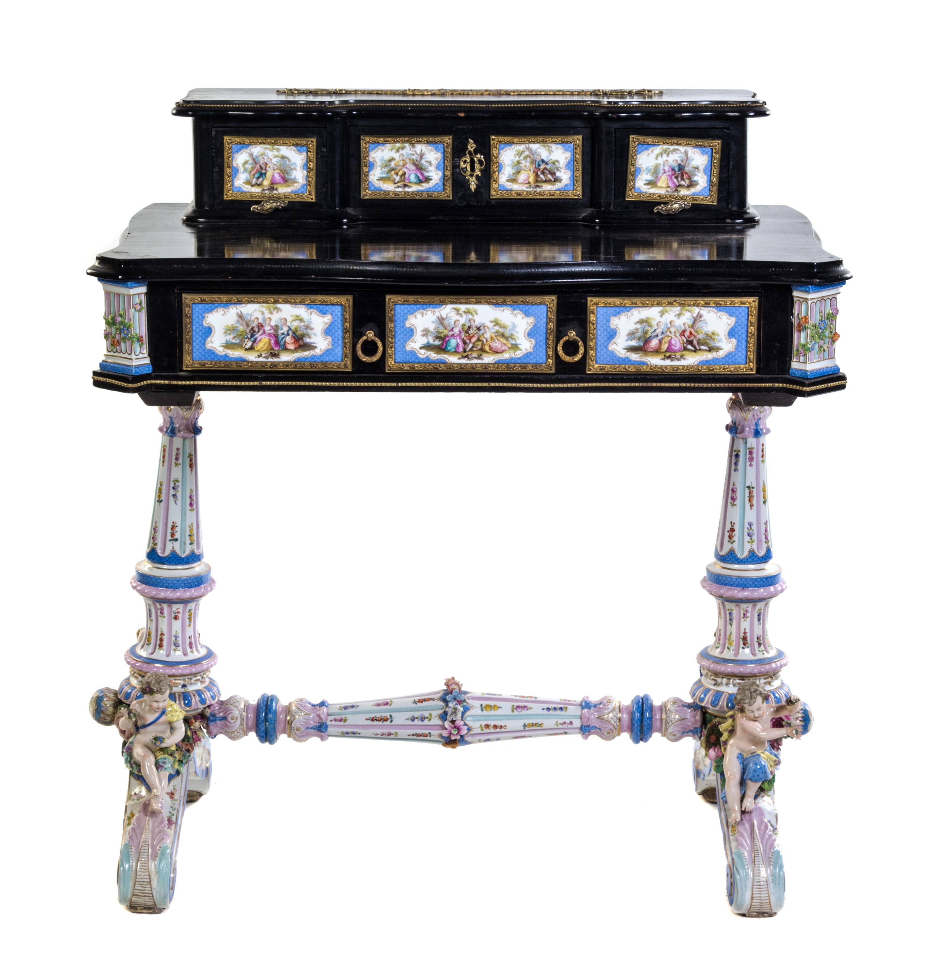 A German Gilt Metal and Porcelain Mounted Ebonized Writing Table Height 36 3/4 x width 34 x depth 20 inches.