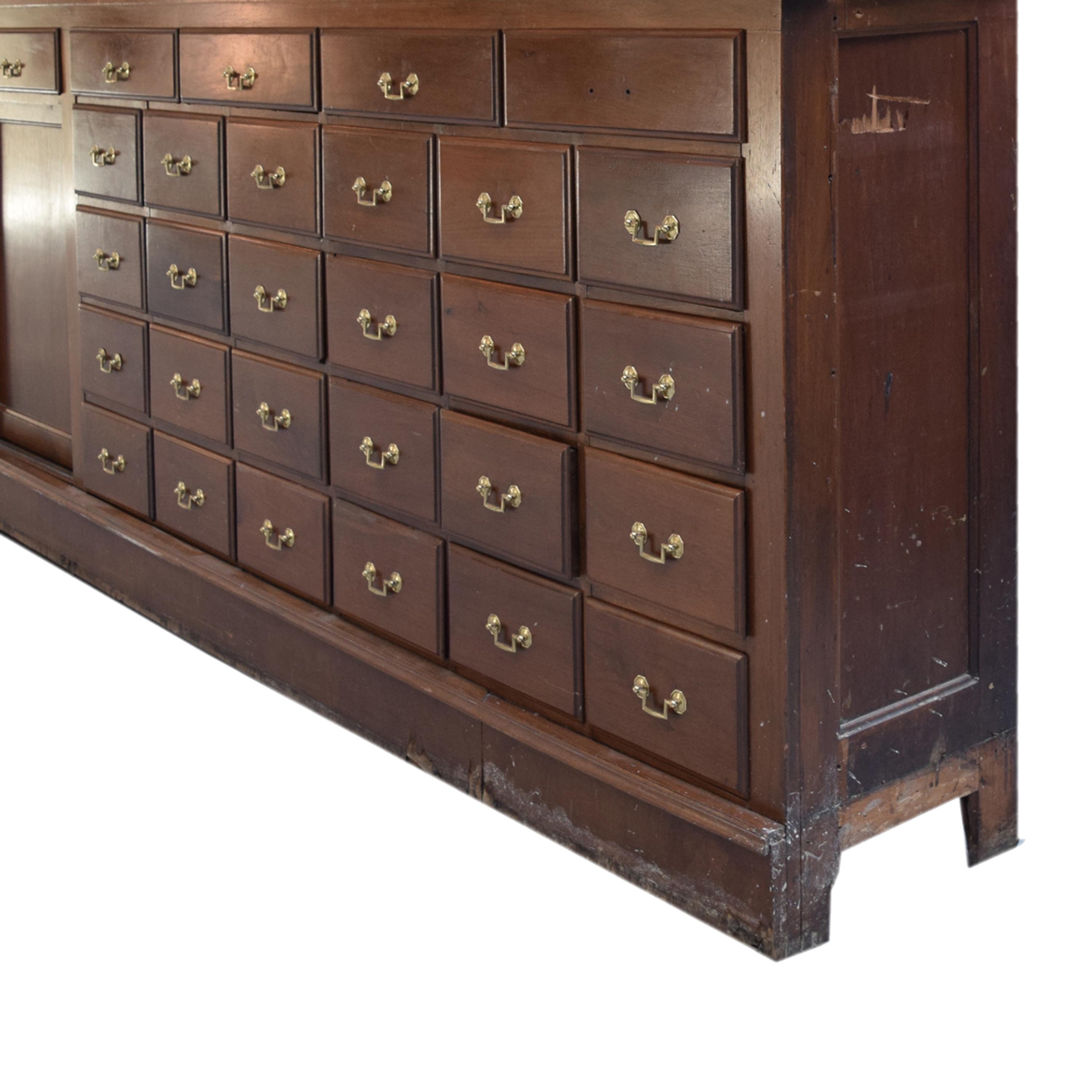A Two-Tier Mahogany Pharmacy Cabinet 165" W x 15" D x 95" H — United States, 20th Century