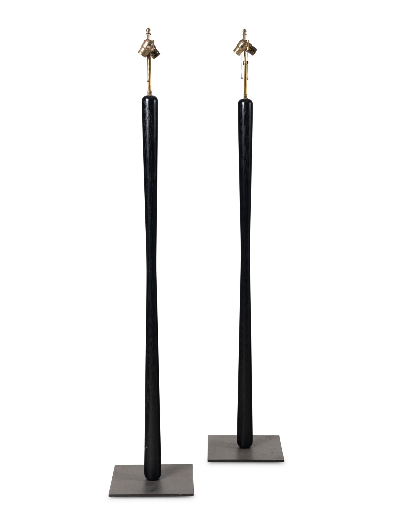 A Pair of Ebonized Wood Floor Lamps