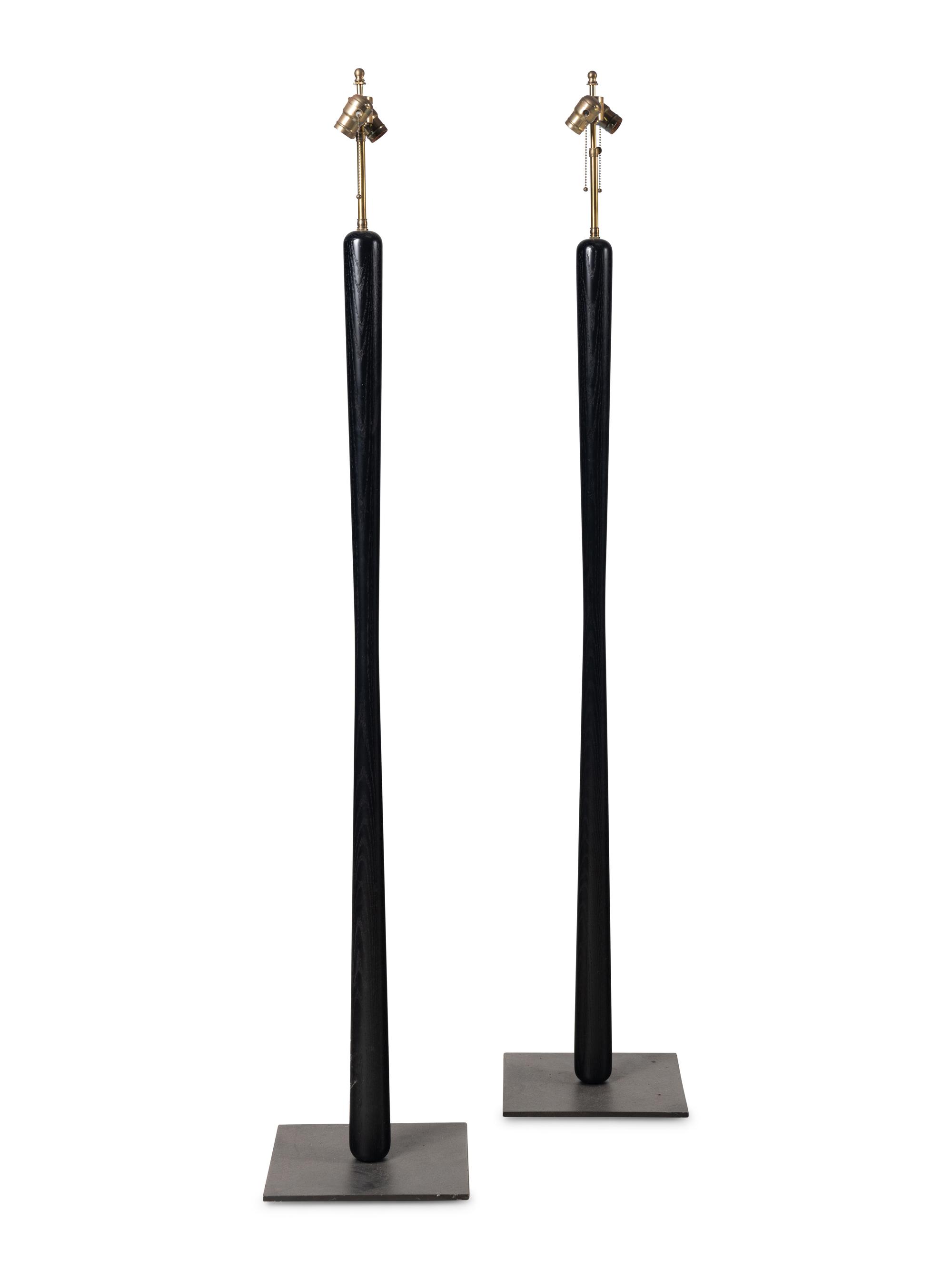 A Pair of Ebonized Wood Floor Lamps