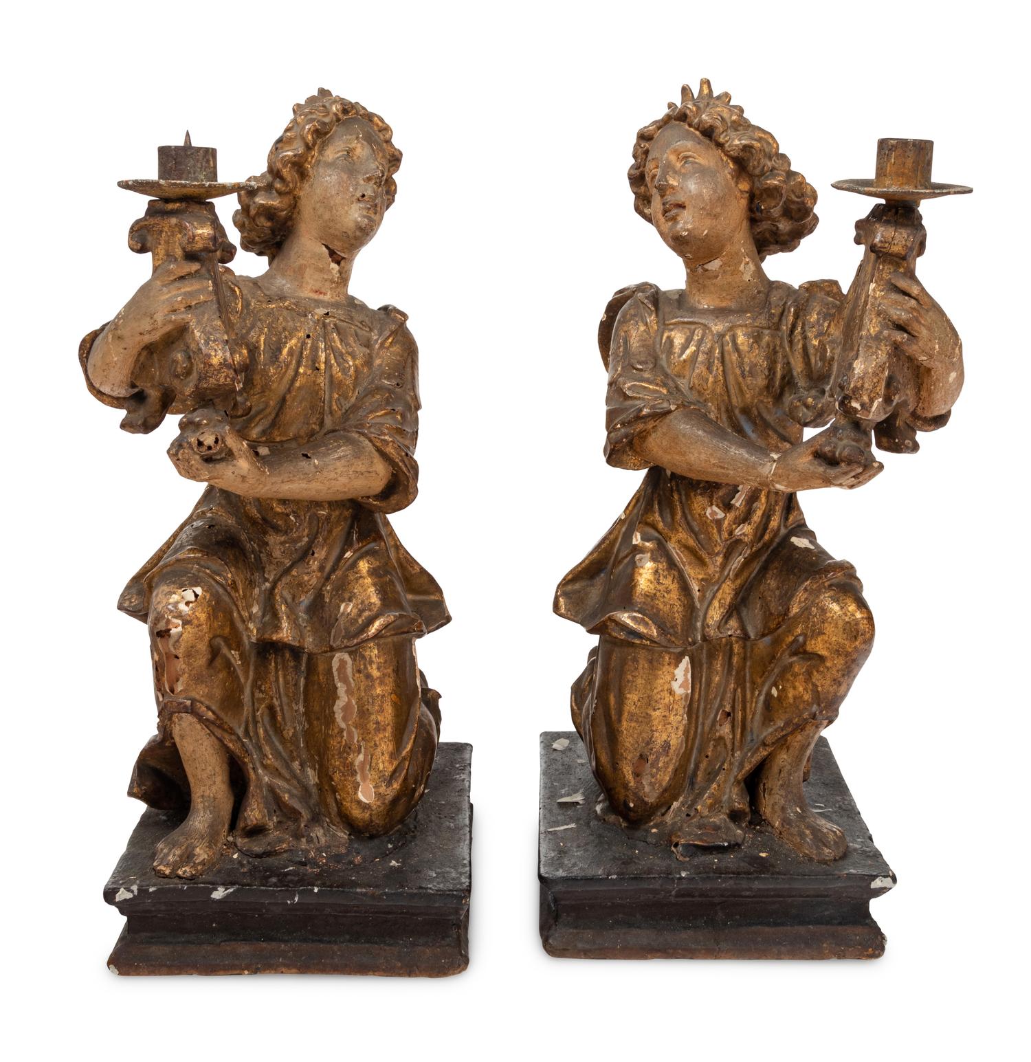A Pair of Continental Giltwood Figural Altar Candlesticks