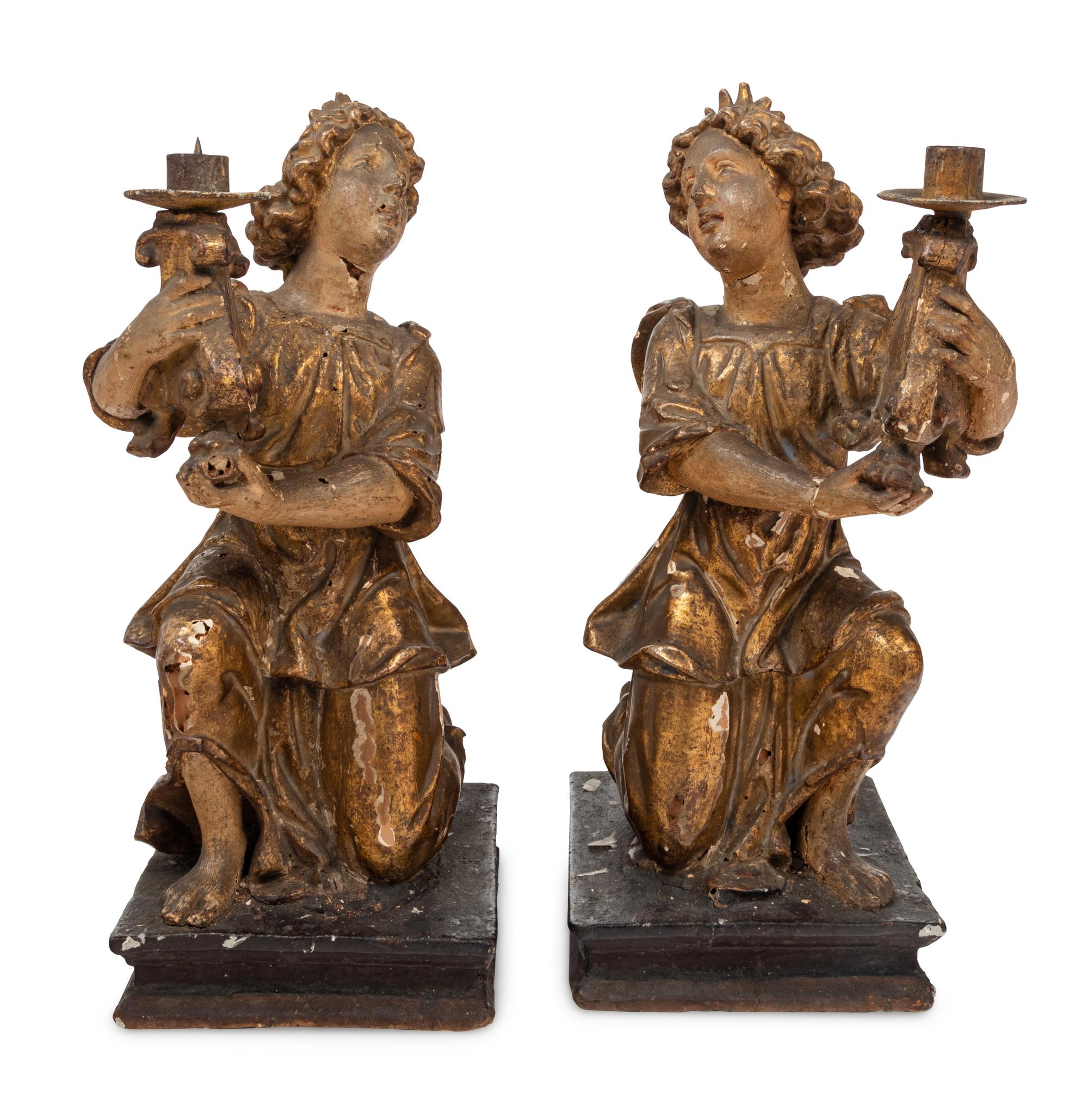 A Pair of Continental Giltwood Figural Altar Candlesticks