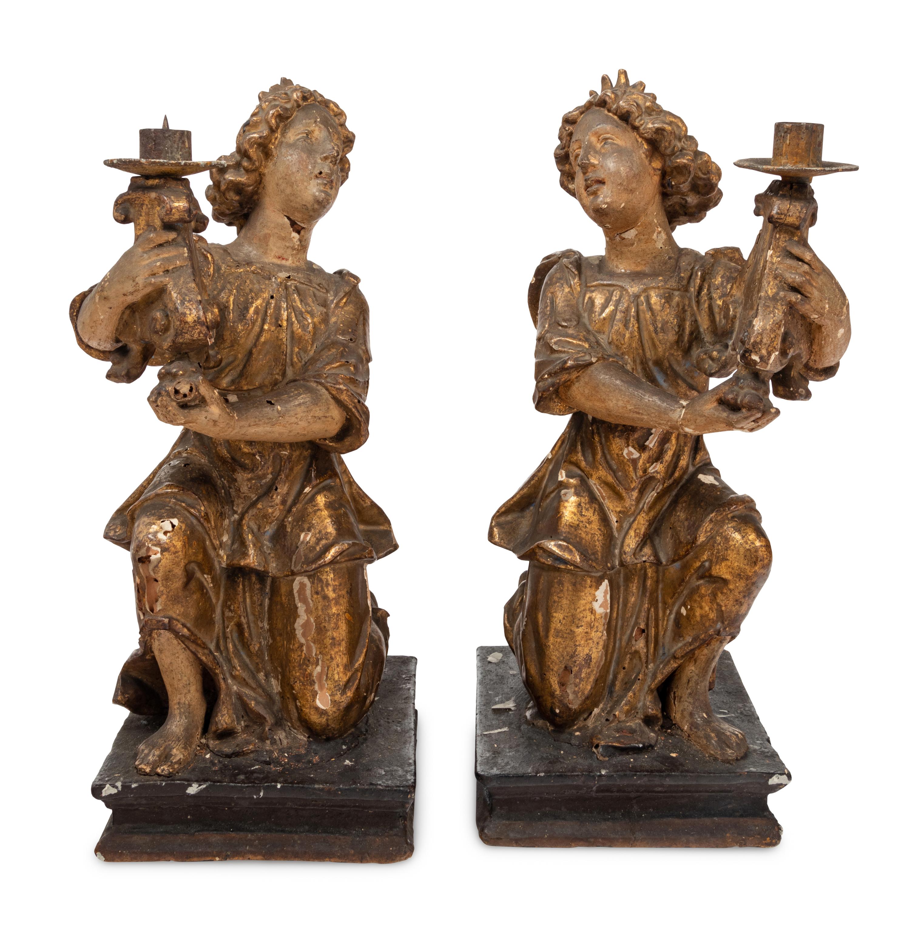 A Pair of Continental Giltwood Figural Altar Candlesticks