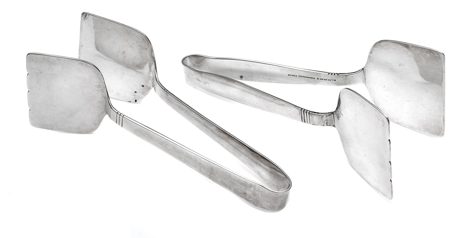 A Pair of American Silver Sandwich Tongs, Alan Adler, Los Angeles, CA, 20th Century, each having a spot-hammered finish with banded dec