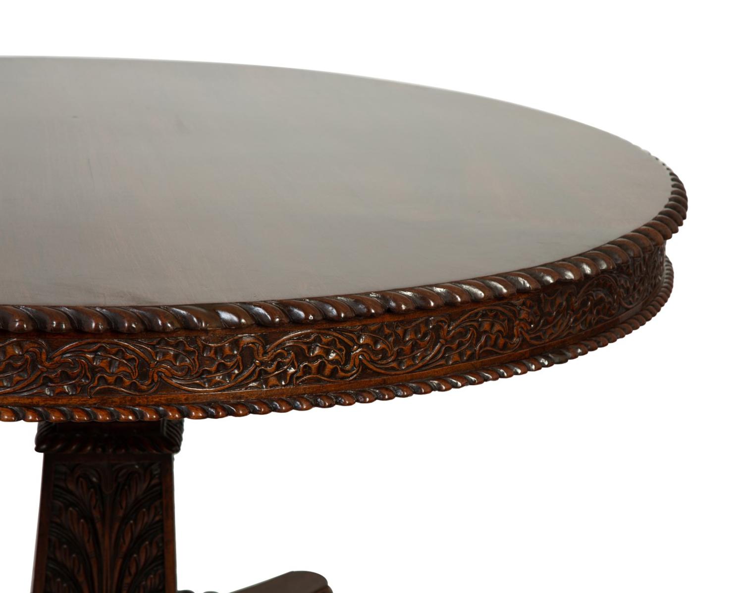 An Anglo-Indian Carved Padouk Wood Tilt Top Center Table — 19TH CENTURY
