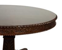 An Anglo-Indian Carved Padouk Wood Tilt Top Center Table — 19TH CENTURY