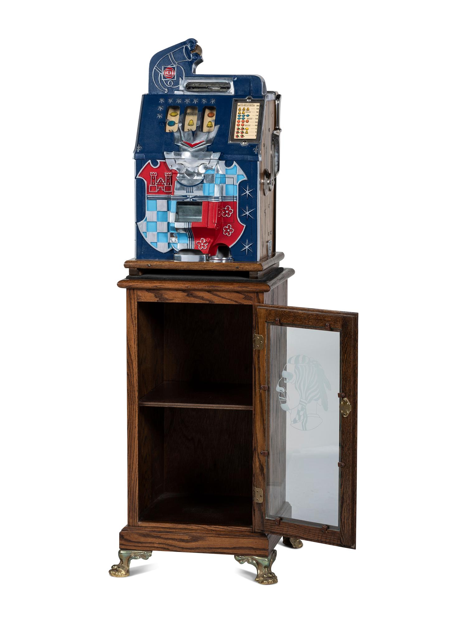 A Mills Novelty Co. Castle Front 50 Cent Slot Machine on Chief's Head Engraved Glass Stand