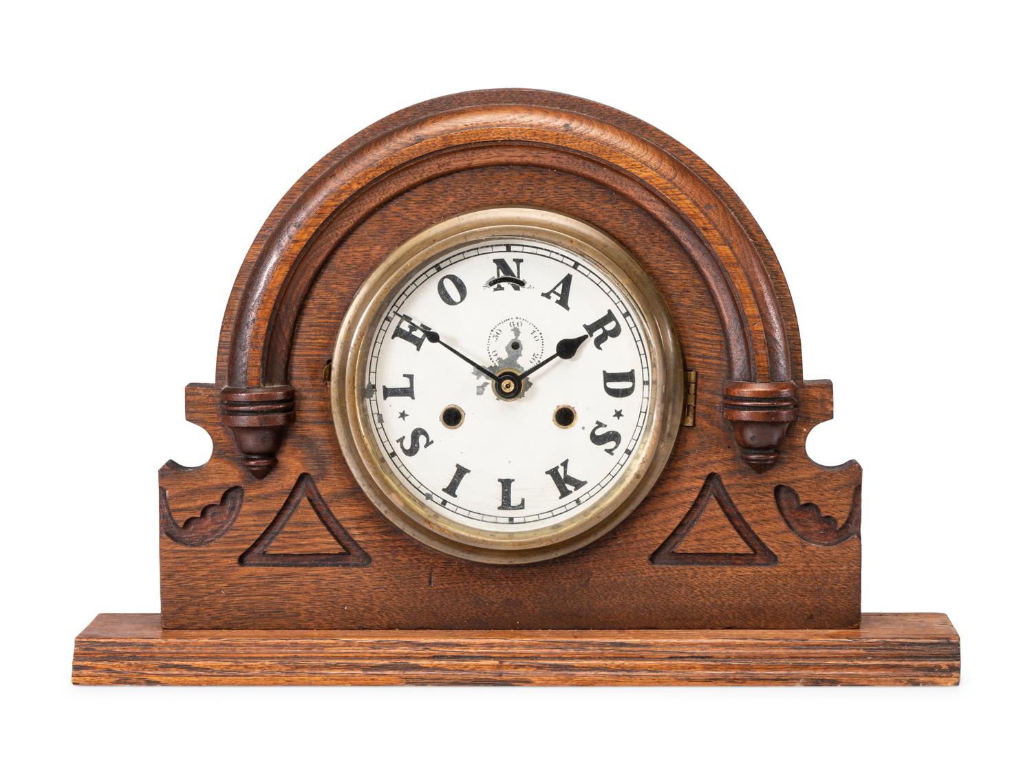 A Leonard Silks Advertising Mantel Clock