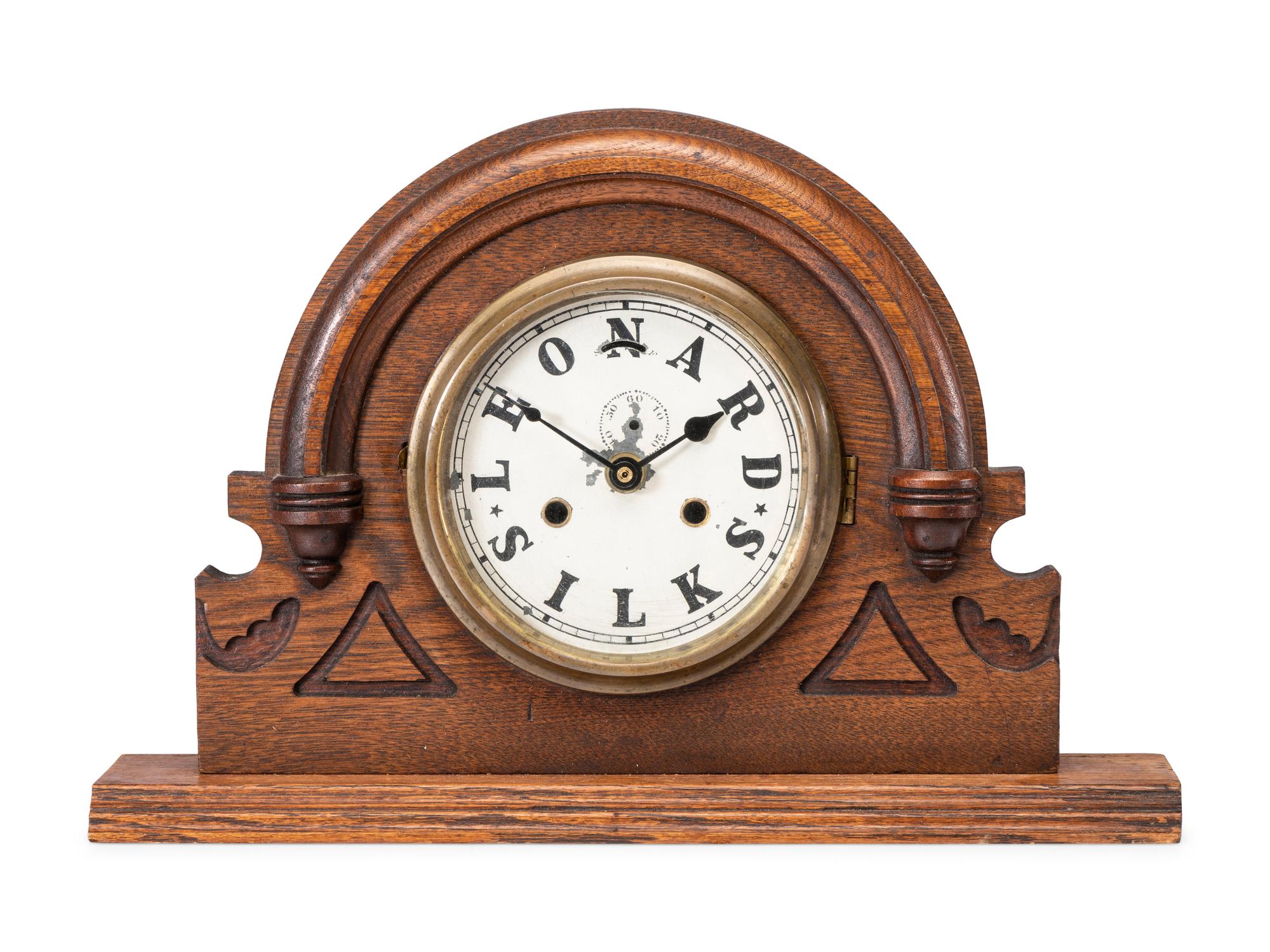 A Leonard Silks Advertising Mantel Clock