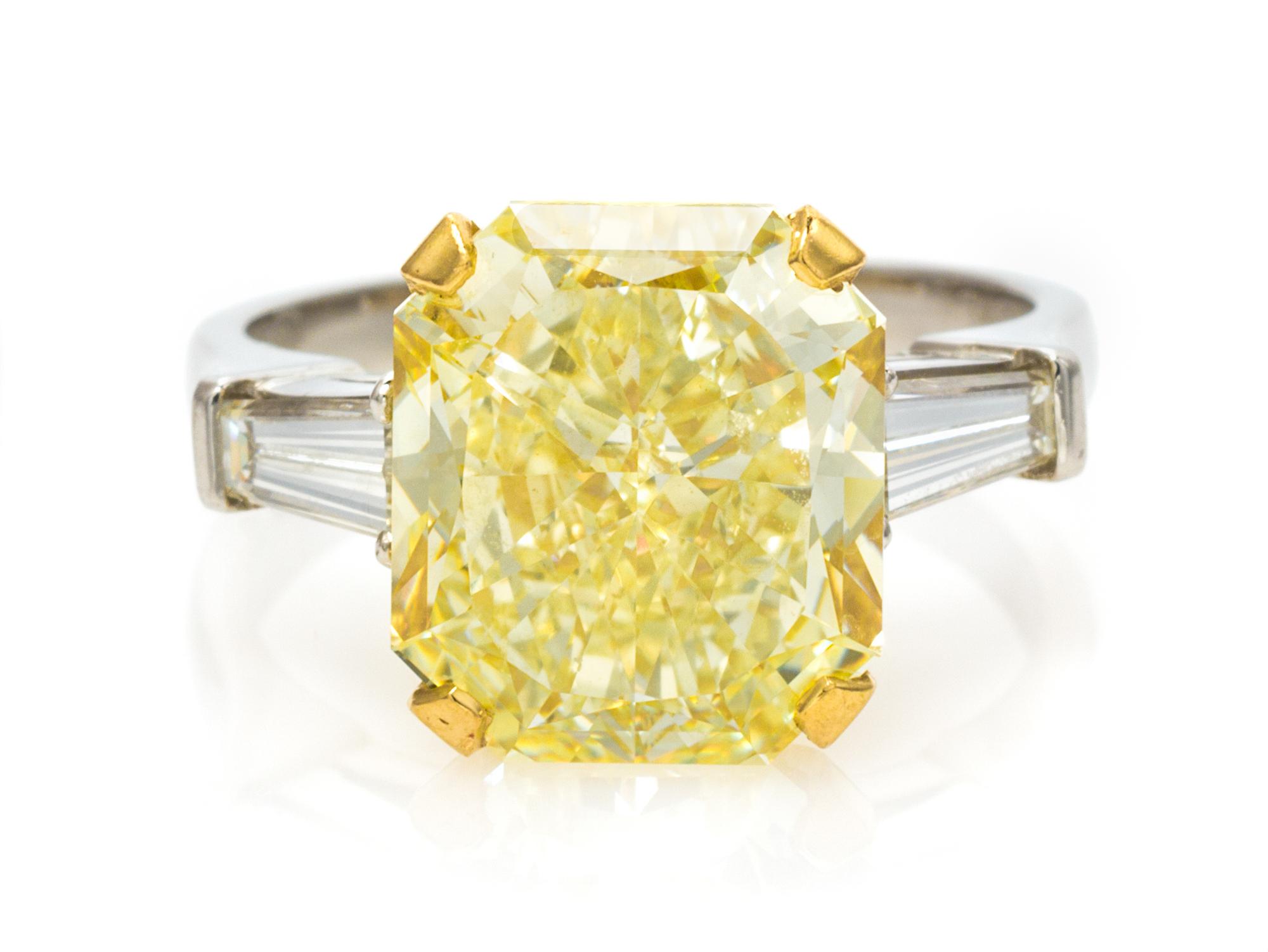 A Platinum, Yellow Gold, Fancy Yellow Diamond and Diamond Ring, Graff, 4.40 dwts.