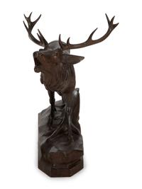 A Swiss Black Forest Carved Walnut Figure of an Elk