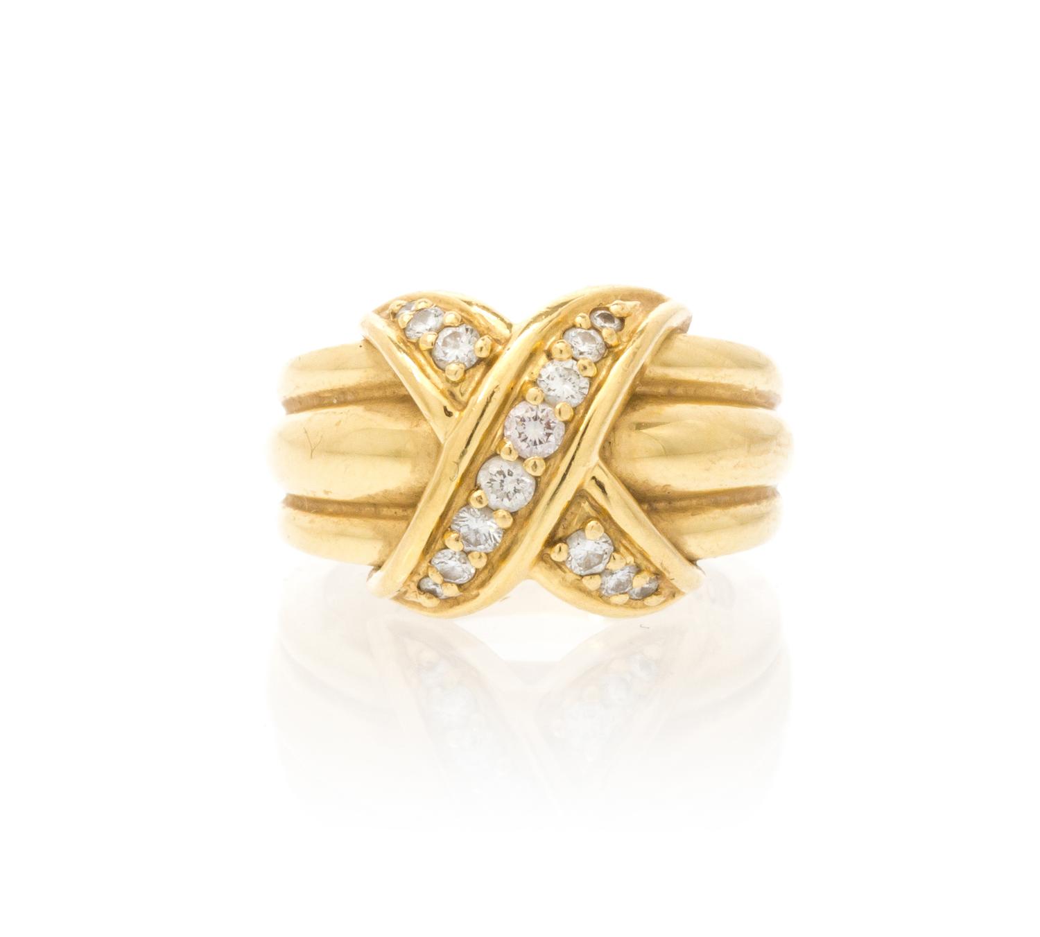 An 18 Karat Yellow Gold and Diamond X Ring, Tiffany & Co., Circa 1990, 8.30 dwts.