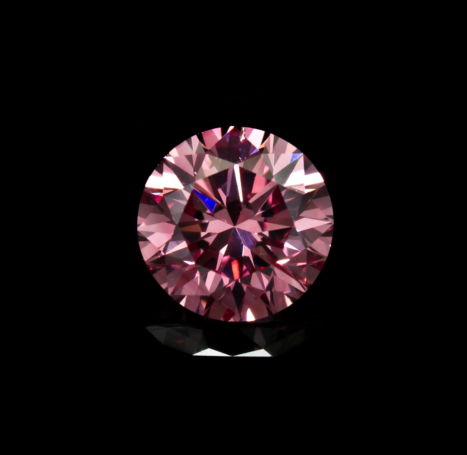 A 0.58 Carat Round Brilliant Cut Fancy Intense Purplish Pink Diamond,