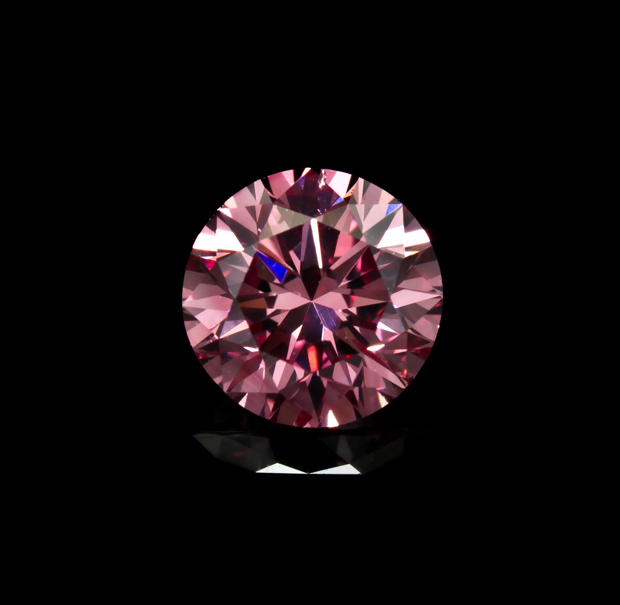 A 0.58 Carat Round Brilliant Cut Fancy Intense Purplish Pink Diamond,