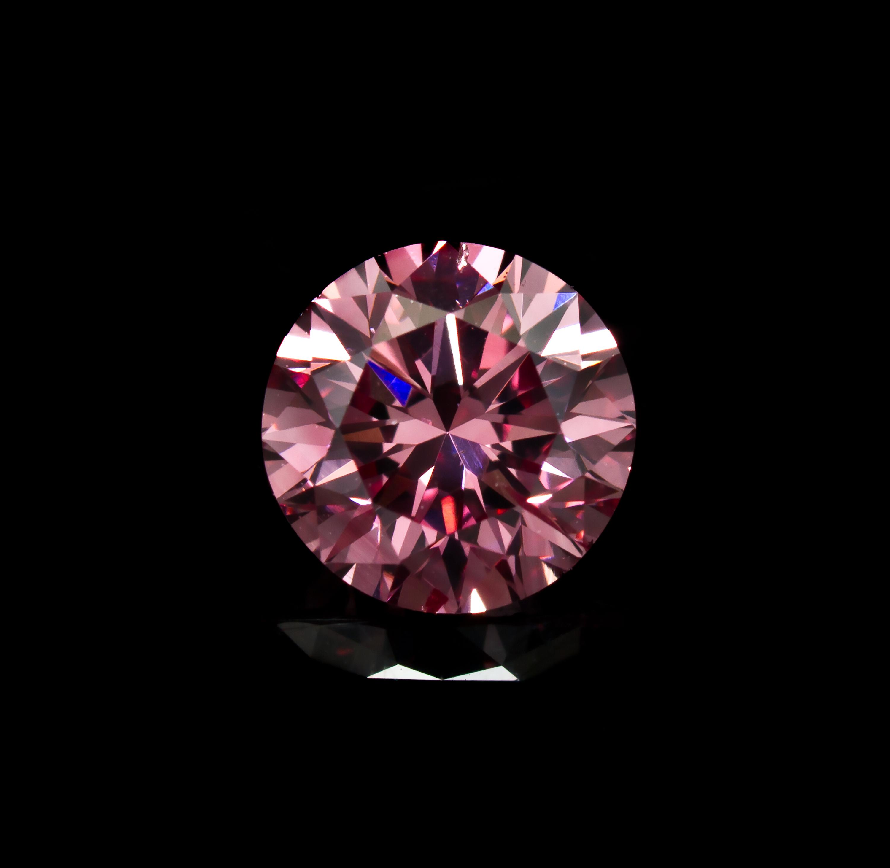 A 0.58 Carat Round Brilliant Cut Fancy Intense Purplish Pink Diamond,