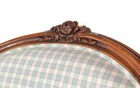 A Louis XV Style Walnut Bergère en Cabriolet