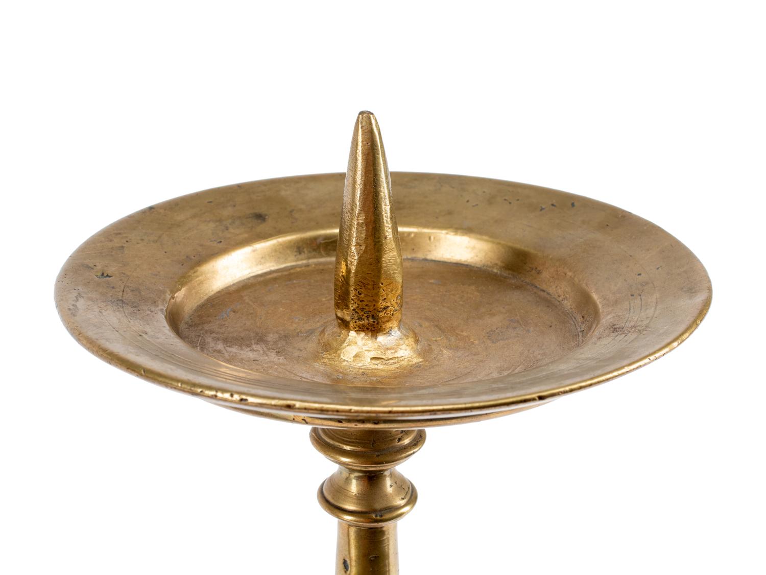 A Pair of Continental Brass Prickets