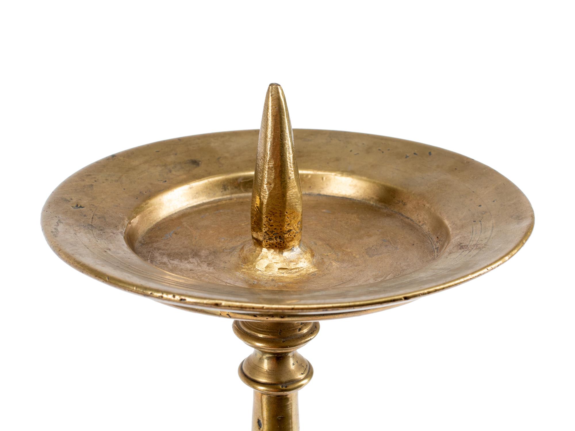 A Pair of Continental Brass Prickets