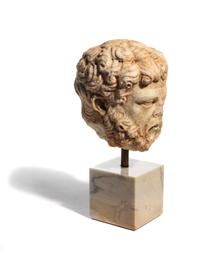 A Roman Marble Head of a Bearded Male, Perhaps Hercules
