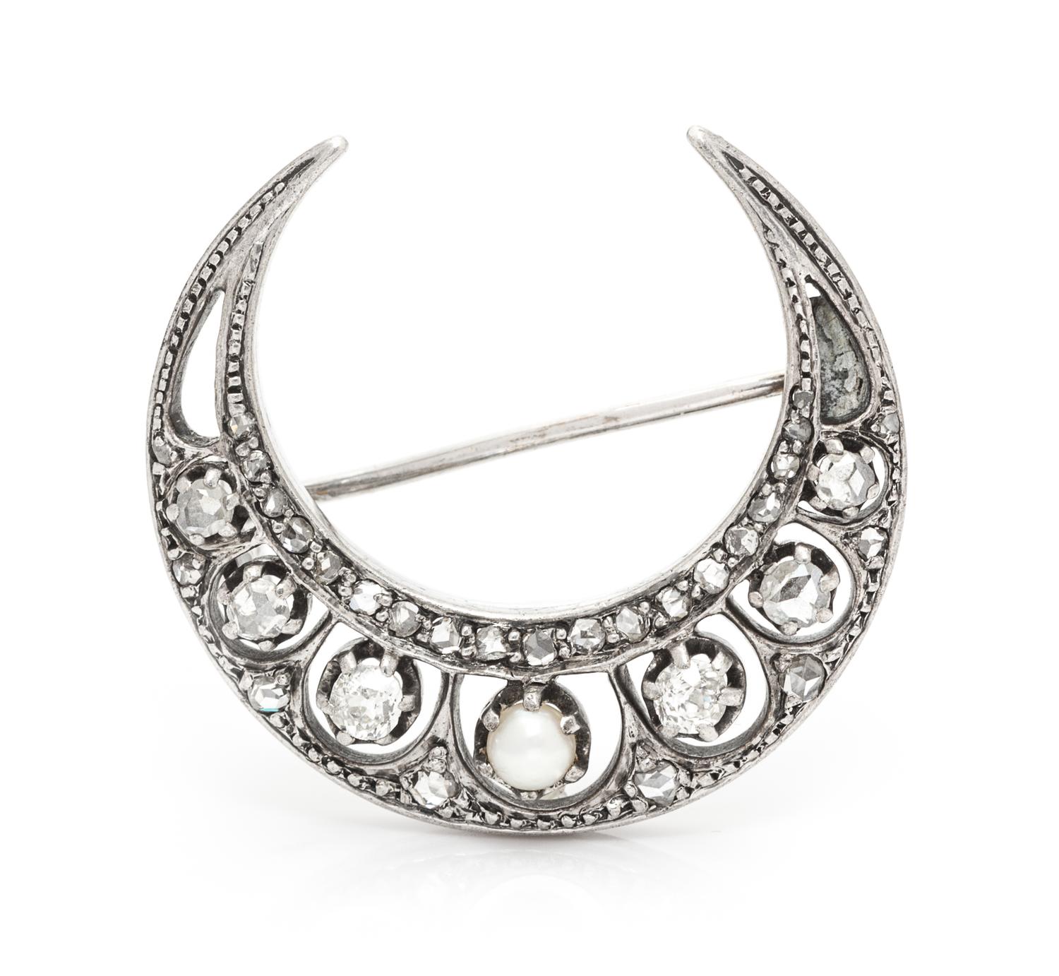 A Victorian Silver Topped Gold, Diamond and Pearl Crescent Brooch, 3.70 dwts.