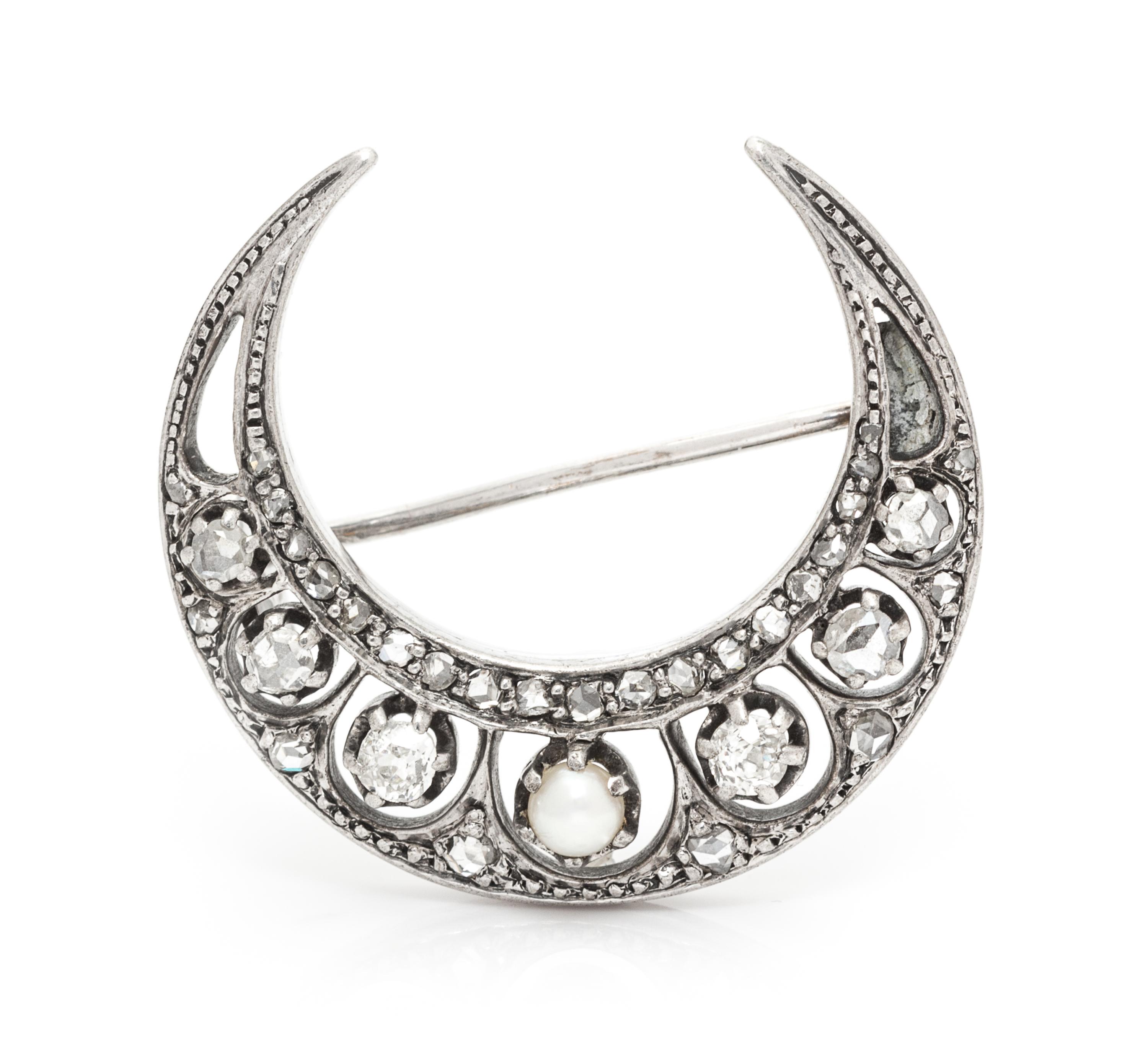 A Victorian Silver Topped Gold, Diamond and Pearl Crescent Brooch, 3.70 dwts.