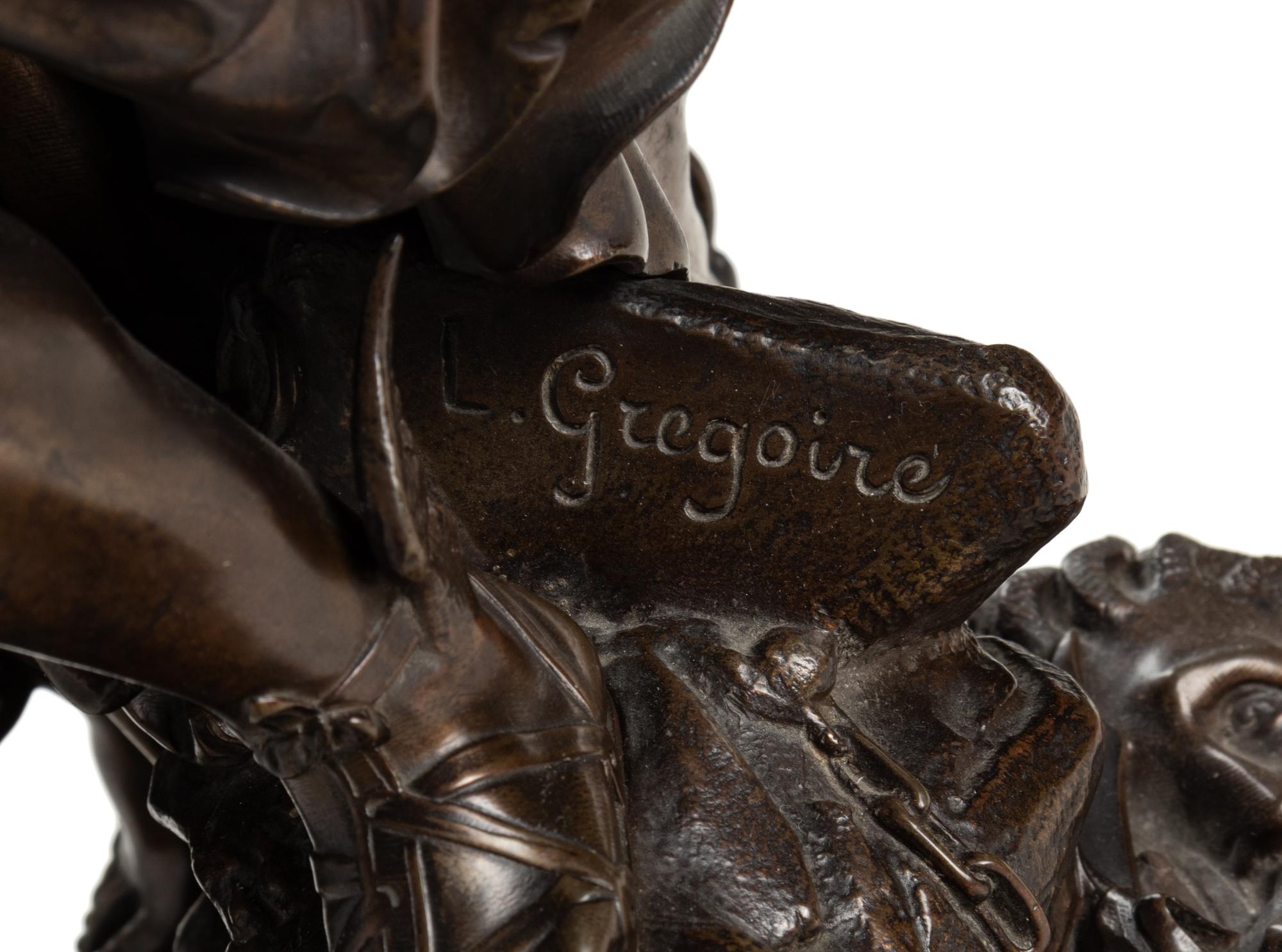 A French Gilt and Patinated Bronze and Marble Mantel Clock