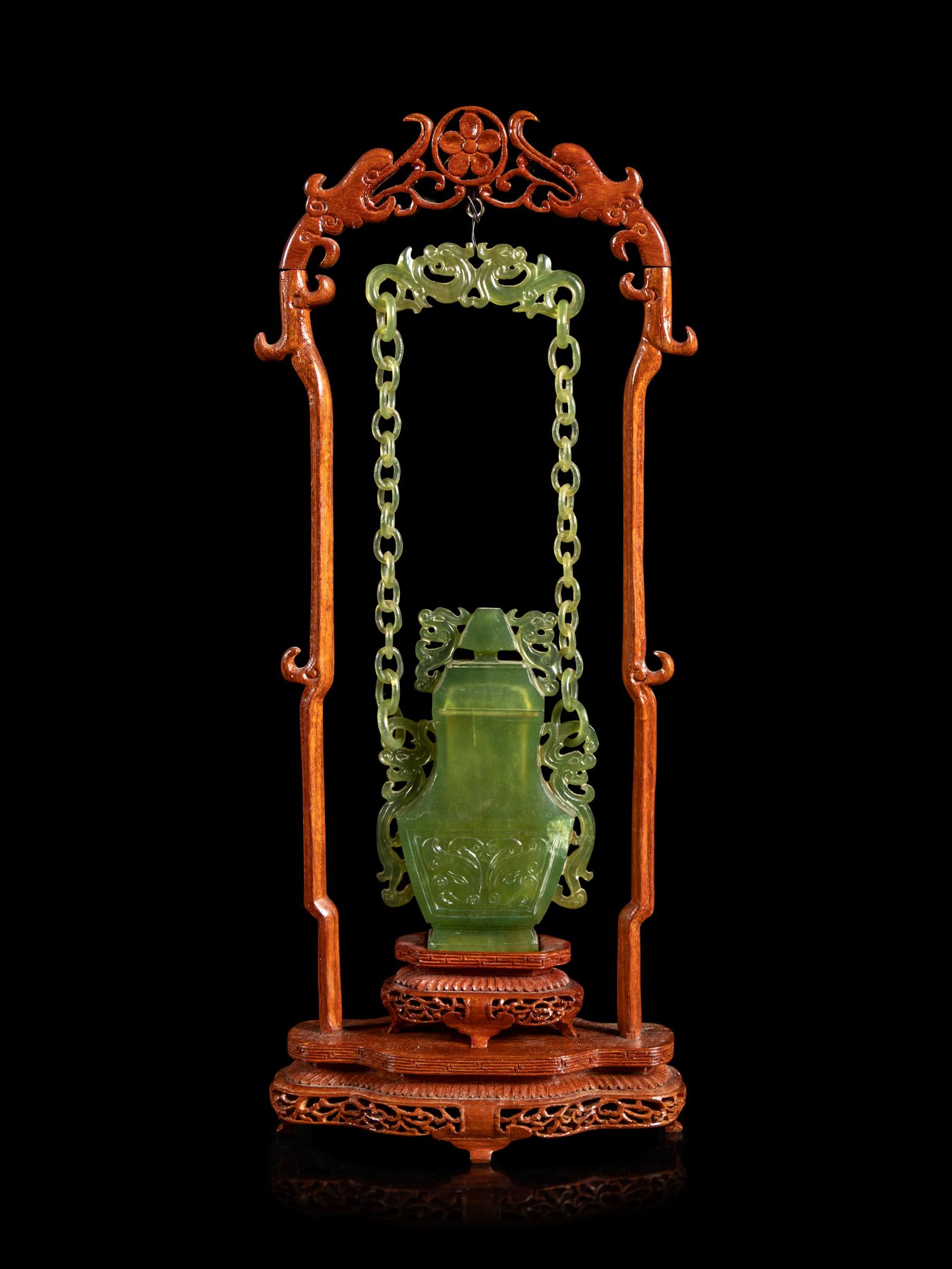 A Chinese Carved Serpentine Hanging Covered Vase