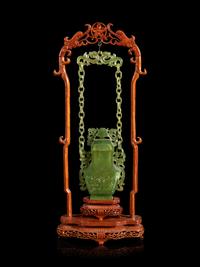 A Chinese Carved Serpentine Hanging Covered Vase