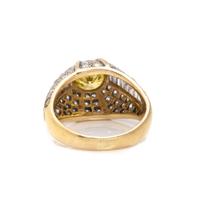 TREATED FANCY VIVID YELLOW DIAMOND AND DIAMOND RING