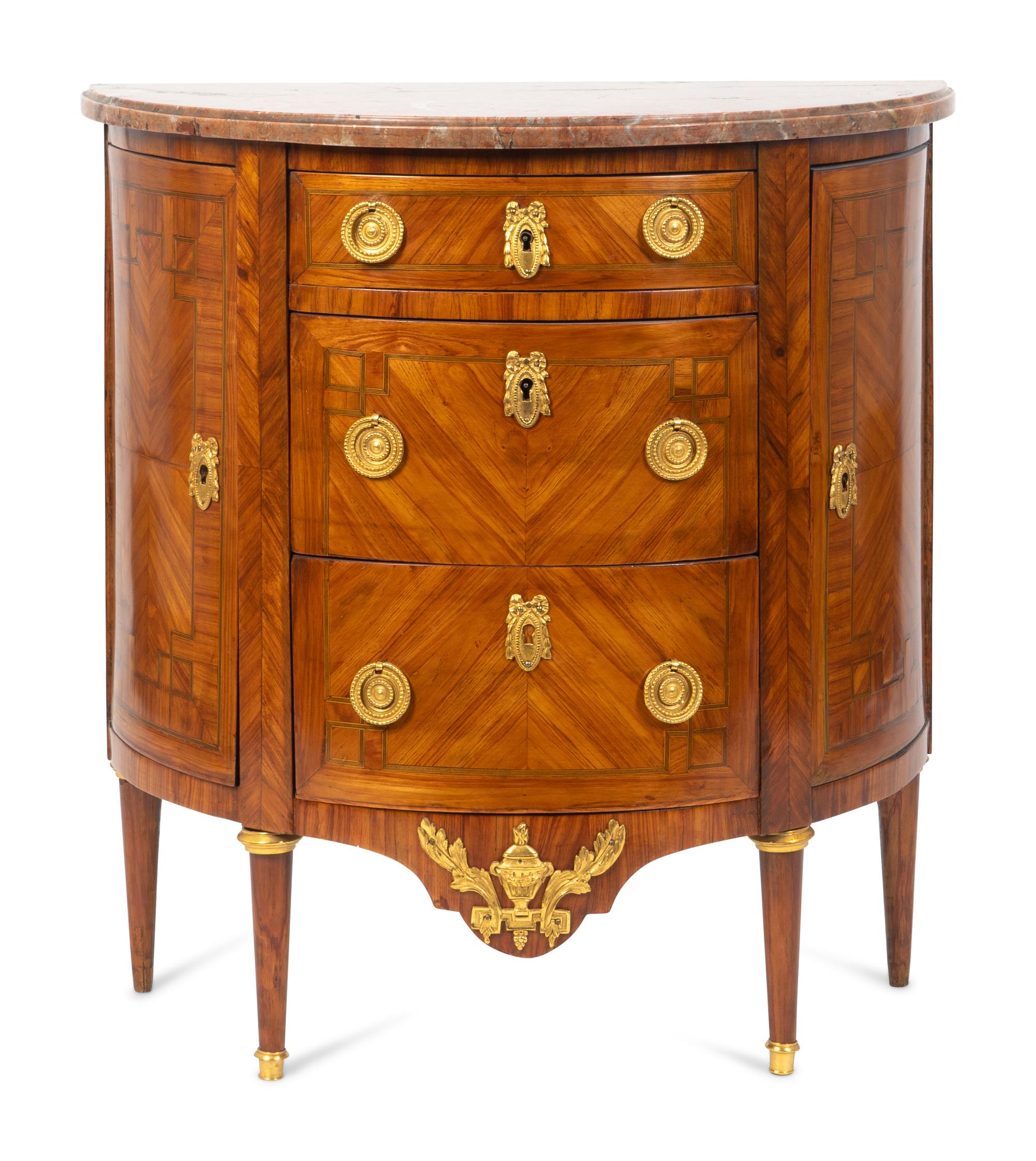 A Louis XVI Gilt-Bronze-Mounted Kingwood Demilune Commode — CIRCA 1790