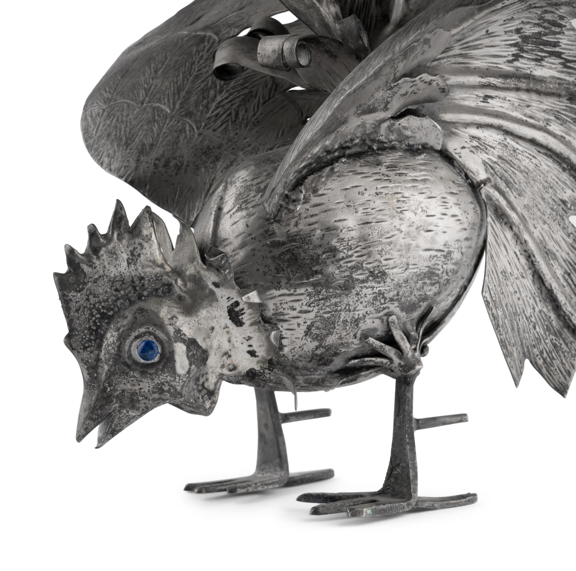 A Pair of Continental Silvered-Metal Roosters