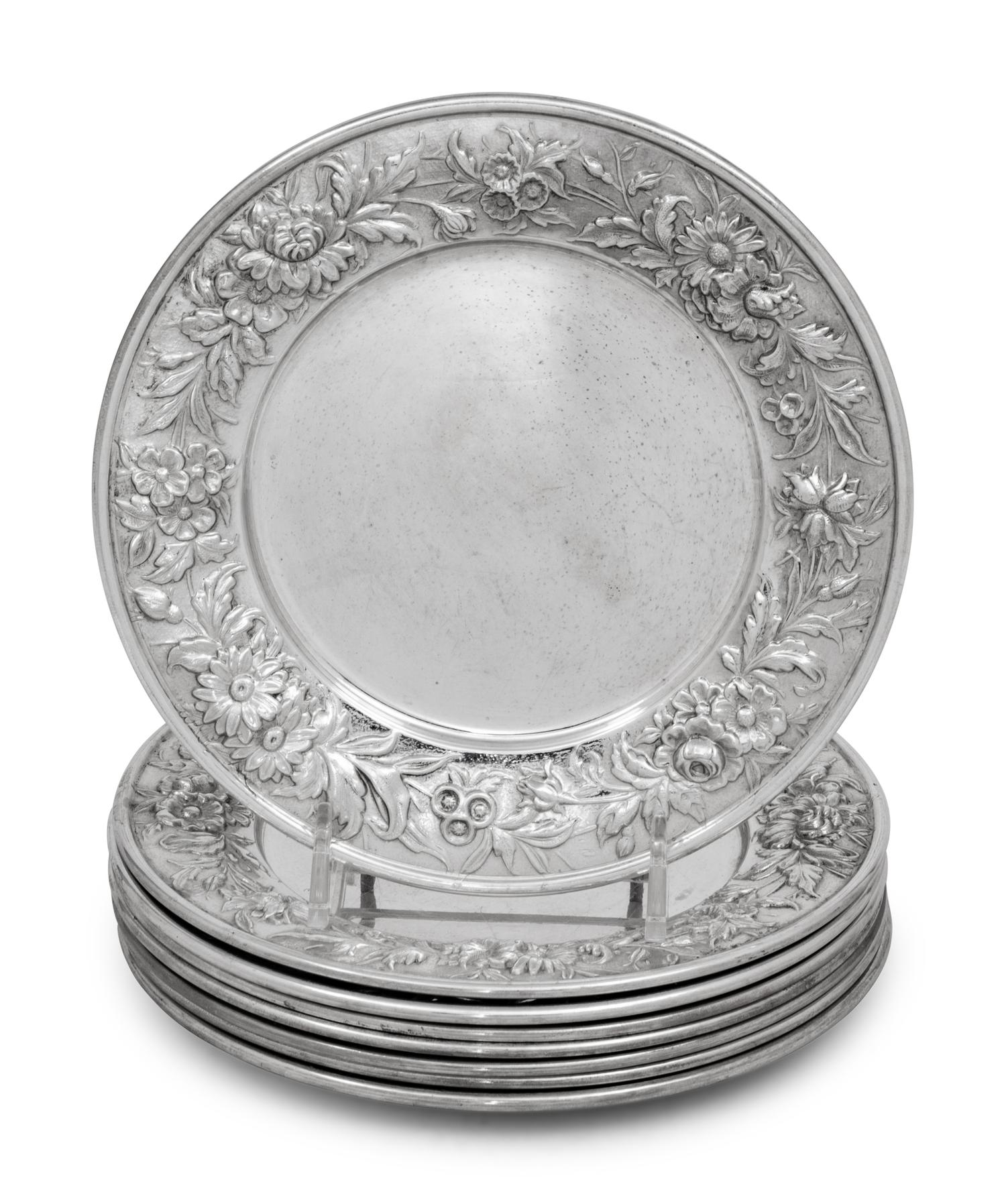 A Set of Eight S. Kirk and Son Repousse Silver Bread Plates